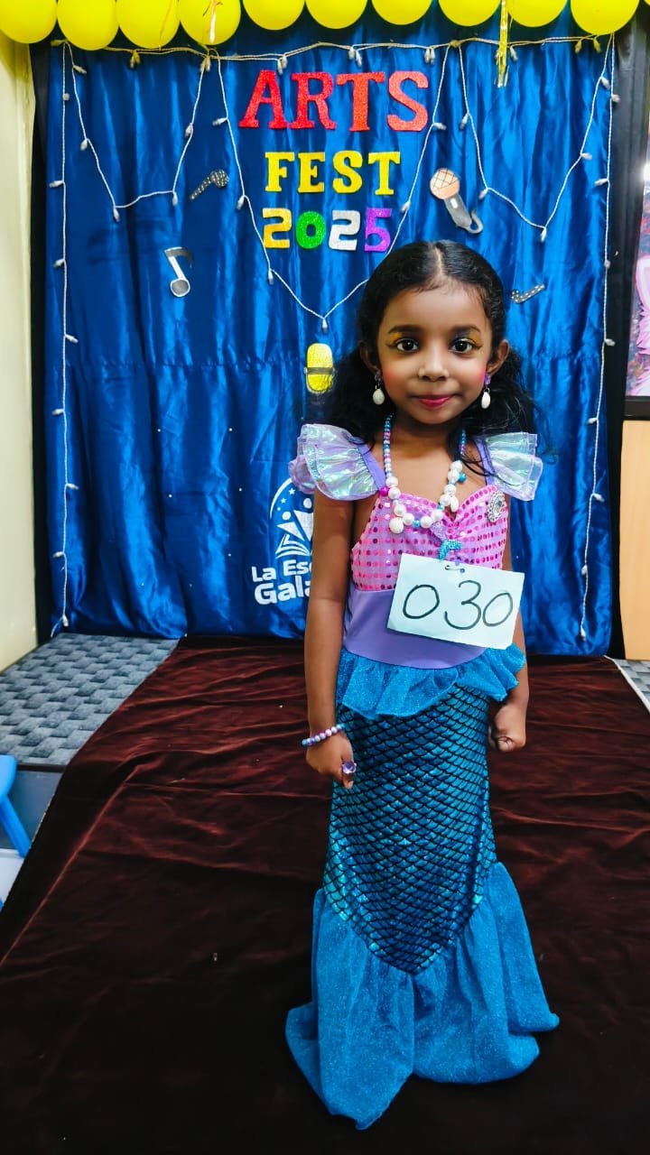 Child in mermaid costume at school arts festival