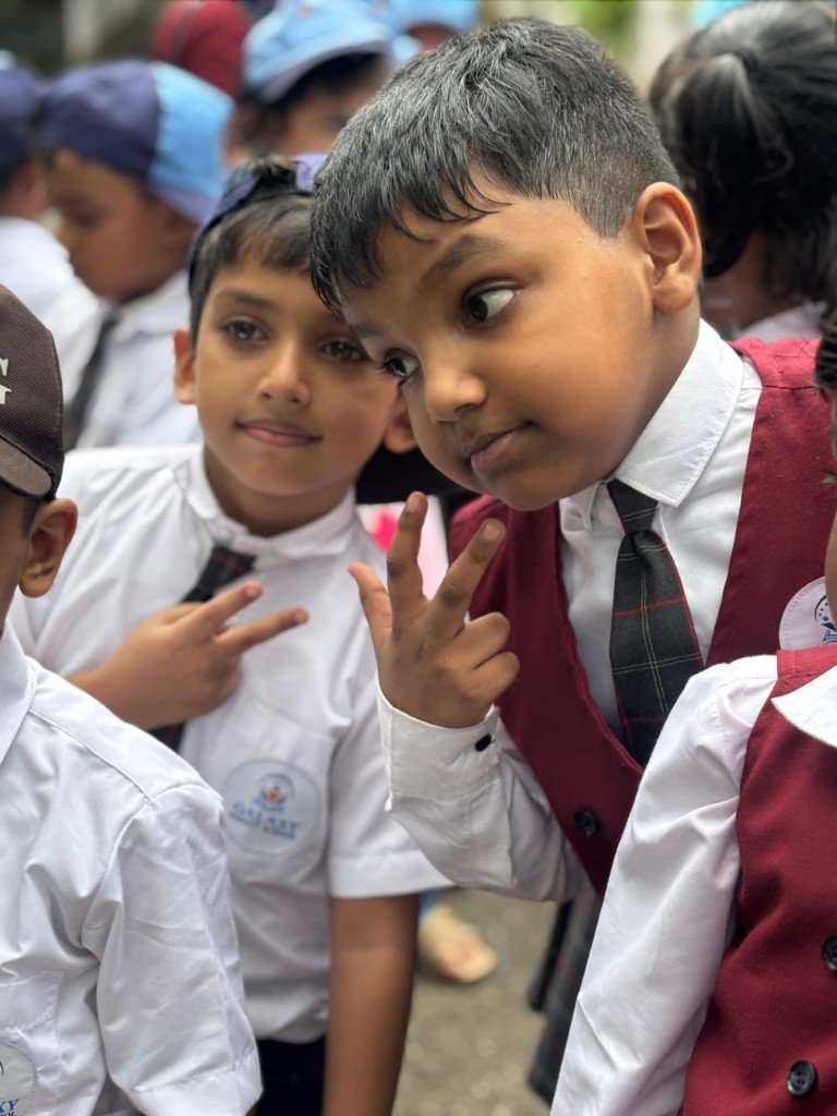 Students in Galaxy uniforms making peace signs