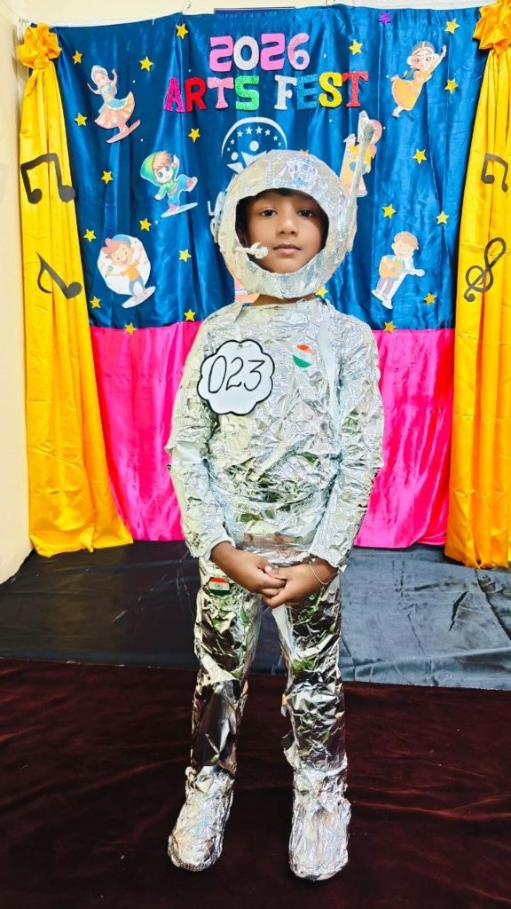 Grade 1 boy in silver astronaut costume at Arts Fest 2026